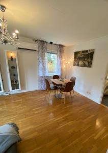 a dining room with a table and chairs in a room at Private Villa Suite with Independent Entrance in Täby