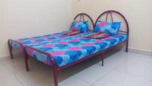 Krevet ili kreveti u jedinici u objektu Taiping Valuable Homestay