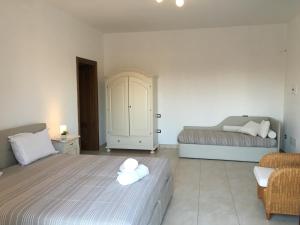 Postel nebo postele na pokoji v ubytování Villa Elia - Tenuta Le Scerze - Salento Homes