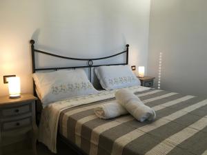 Postel nebo postele na pokoji v ubytování Villa Elia - Tenuta Le Scerze - Salento Homes
