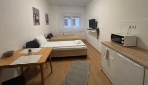 Kuchyň nebo kuchyňský kout v ubytování Hungaria Apartments