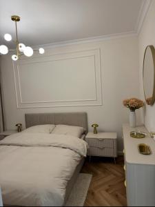 En eller flere senge i et værelse på Apartament Villa Piano