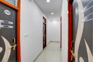 a hallway with a door at Hotel O Shree Ladli Hotel in Lucknow +21 photos
