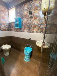 a bathroom with a shower and a toilet and a sink at Citizen Society, Ellora Park, is very peaceful in Vadodara