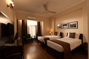 Broadway An Alivaa Collection Hotelにあるベッド