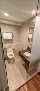 a bathroom with a toilet and a sink at GR Ming garden SCSP in Kota Kinabalu