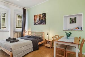 En eller flere senge i et værelse på Lauben Apartment II Bolzano