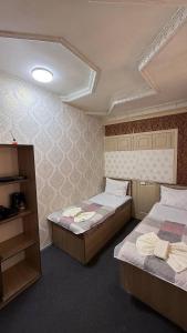 Ένα ή περισσότερα κρεβάτια σε δωμάτιο στο Aqso Hotel