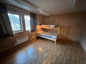 a small room with a bunk bed in it at Haraldvollen Red Cross Center in Bardufoss