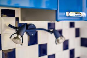 a pair of lights sticking out of a bathroom wall at Palme d'or in Cannes