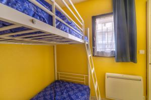 a small room with bunk beds and a window at Palme d'or in Cannes +15 photos