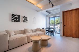 a living room with a couch and a table at Modern 2BR-Old Town Pafos in Paphos