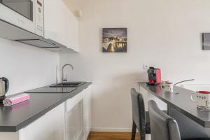 Køkken eller tekøkken på Studio tranquillité-Parking-Proche de la Doua