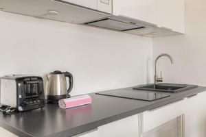 Køkken eller tekøkken på Studio tranquillité-Parking-Proche de la Doua