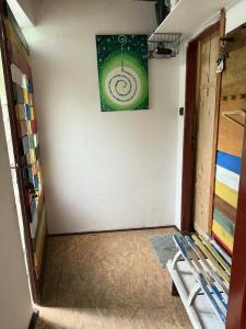 a room with a wall with a painting on the wall at Cozy cottage in the heart of Čičmany in Čičmany +1 photo