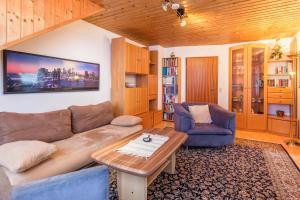 a living room with a couch and a coffee table at Ferienwohnung Schlegel in Singen