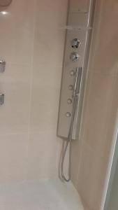 a white bathroom with a shower with a shower at Elegant Apart in City Centre of Cannes in Cannes