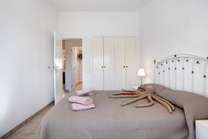 a bedroom with a bed with an octopus on it at Casa Velázquez in Puerto del Rosario
