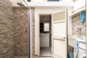 a bathroom with a shower and a sink at Gió home in Santa Maria al Bagno +12 photos