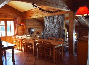 a dining room with a table and chairs at Le vieux madrier in La Clusaz +36 photos