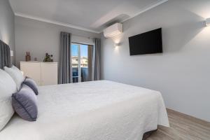 Postel nebo postele na pokoji v ubytování T1 Plaza Resort + 17 fotografií