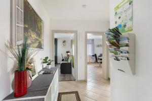 a living room with a red vase on a table at Ferienwohnung Zum Hasen in Meschede