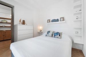 Giường trong phòng chung tại Casa i Lentischi