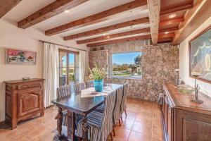 a dining room with a table and chairs at Bonnix in Alcudia