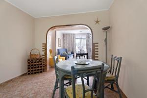 a dining room with a table and a mirror at Apartment Colina Vista in Los Cristianos