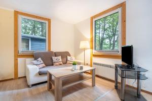 Μια τηλεόραση ή/και κέντρο ψυχαγωγίας στο Bungalow zum Leuchturm, Bgl 20