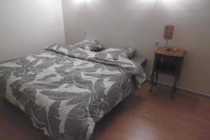 Ένα ή περισσότερα κρεβάτια σε δωμάτιο στο Gîte Le Lot