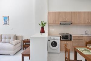a kitchen and a living room with a washing machine at Port House in Kos Town +15 photos