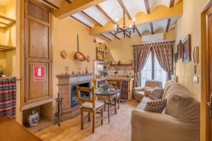a living room with a couch and a table at Albahaca in Hinojares