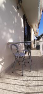 a table and two chairs sitting at a table at Il Nido di Chiara in Formia