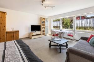 a living room with a couch and a table at Ferienwohnung am Bregenberg in Bräunlingen
