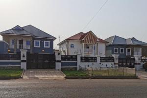 a row of houses in a row with a fence at 1 Bed Apartment Sleeps 2 - Parking Garden Wifi in Accra