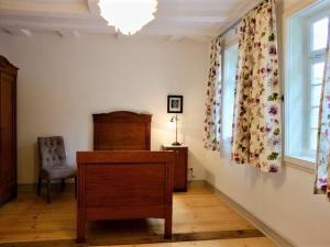 a room with a desk and a chair and a window at Ferienhaus Schäferhaus in Frielendorf +12 photos