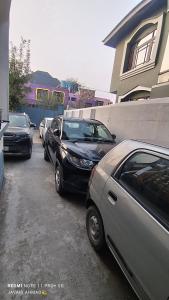 a row of cars parked in a parking lot at The Vintage Kashmir Homestay in Srinagar
