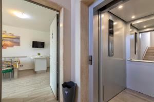 a hallway with a door leading to a room at Tirreno apartment in Alghero