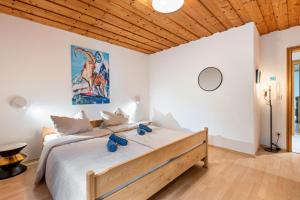 Postel nebo postele na pokoji v ubytování Ferienhaus Sonnenplatz Am See