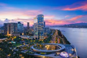 a view of a city at night with a river at Shangri-La Wenzhou in Wenzhou