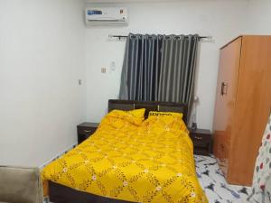 Postel nebo postele na pokoji v ubytování Metropolitan Manor Apartments