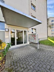 a building with a brick patio in front of a building at Köschenrütistrasse 59, 8052 Zürich, Switzerland in Zürich +20 photos