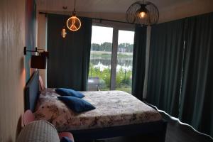 Postel nebo postele na pokoji v ubytování Central Riverside Apartments