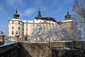 a large building with snow on the ground at Apartment Remise in Langenburg +15 photos
