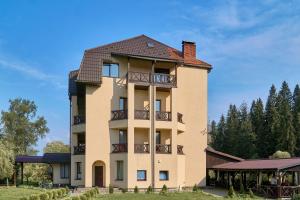 a building with balconies on the side of it at Aratta in Pilipets
