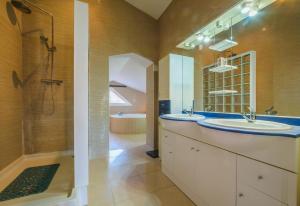 a bathroom with two sinks and a shower at Mas Mestre in Olivella +16 photos