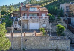 a house on top of a stone wall at Mas Mestre in Olivella