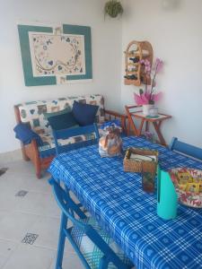a living room with a table and a couch at Vacanze da Rosalbita in Bagheria