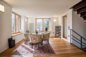 a dining room with a table and chairs at Villa Iagra in Tiarno di Sopra